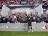 Leicester City's Kasper Schmeichel and teammates celebrate with the trophy after winning the FA Community Shield on August 7, 2021