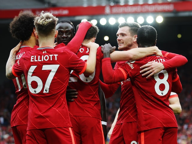 Liverpool's Diogo Jota celebrates scoring their first goal with teammates on August 8, 2021