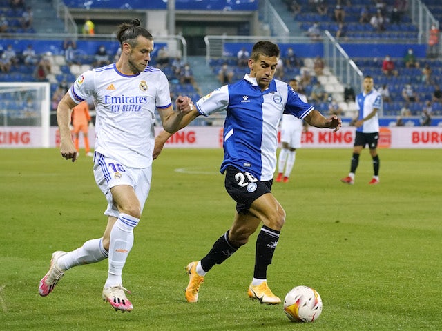 Real Madrid's Gareth Bale in action with Deportivo Alaves' Pere Pons in La Liga on August 14, 2021