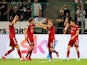 Bayern Munich's Robert Lewandowski celebrates scoring their first goal with teammates on August 13, 2021