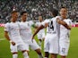 Borussia Monchengladbach's Alassane Plea celebrates scoring their first goal with teammates on August 13, 2021