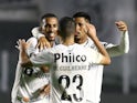 Santos' Lucas Braga celebrates with teammates after an own goal scored by Libertad and Santos' second on August 13, 2021
