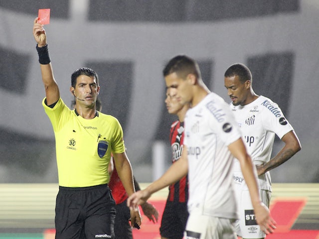 Santos' Kaiky is shown a red card by referee Leodan Gonzalez on August 13, 2021
