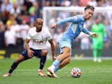 Manchester City's Jack Grealish in action with Tottenham Hotspur's Lucas Moura in the Premier League on August 15, 2021