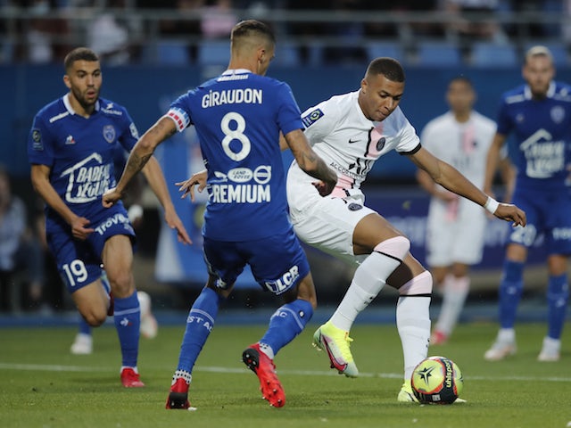 Paris Saint-Germain's Kylian Mbappe in action with Troyes' Jimmy Giraudon on August 7, 2021