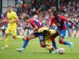 Brentford's Rico Henry in action with Crystal Palace's Conor Gallagher and Wilfried Zaha in the Premier League on August 21, 2021