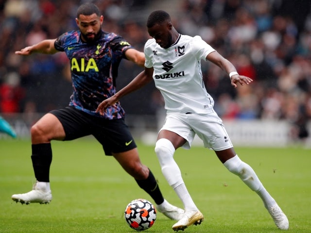 MK Dons striker Mohamed Eisa in action with Tottenham Hotspur's Cameron Carter-Vickers on July 28, 2021