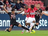 PSV Eindhoven's Noni Madueke in action with FC Midtjylland's Paulinho on August 10, 2021