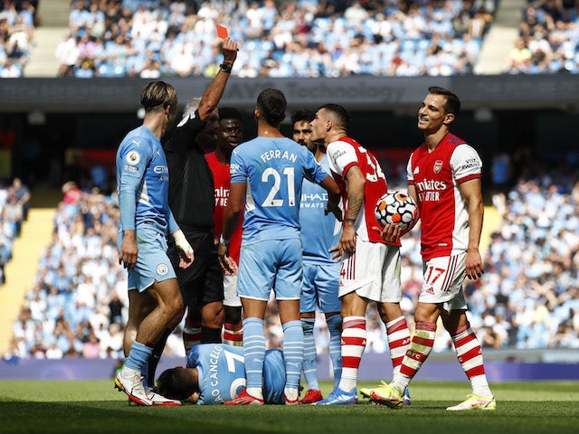 Arsenal's Granit Xhaka is shown a red card by referee Martin Atkinson on August 28, 2021