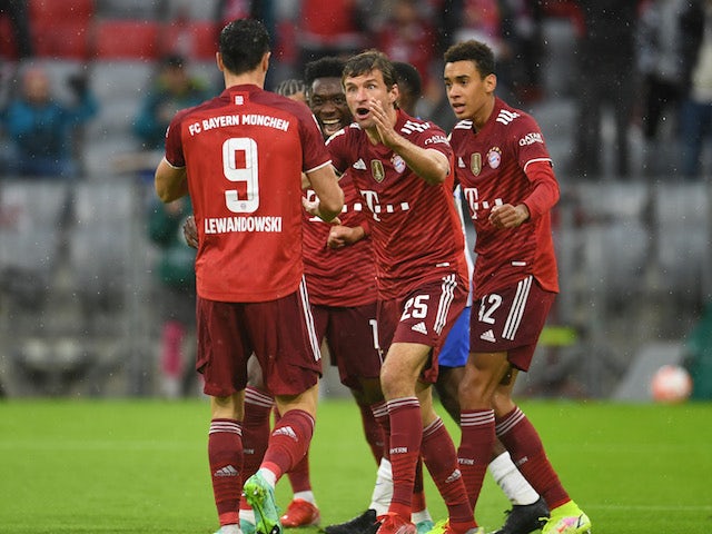 Bayern Munich's Thomas Muller celebrates scoring their first goal with Robert Lewandowski on August 28, 2021
