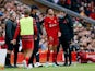 Liverpool's Curtis Jones receives medical attention after sustaining an injury in a tackle with Osasuna's Unai Garcia as Liverpool manager Jurgen Klopp looks on