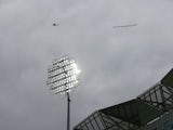 A plane flies overhead with a banner reading 'Sack the ECB and save test cricket on August 27, 2021