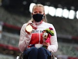 Gold Medallist Hannah Cockroft of Britain celebrates on the podium at the Tokyo Paralympics on August 29, 2021