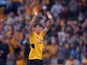 Wolverhampton Wanderers new signing Hwang Hee-chan waves to fans on the pitch before the match on August 29, 2021