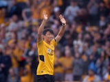 Wolverhampton Wanderers new signing Hwang Hee-chan waves to fans on the pitch before the match on August 29, 2021
