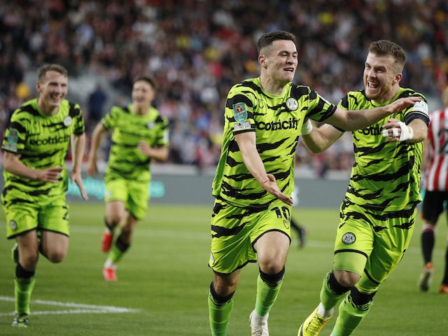 Forest Green Rovers' Jack Aitchison celebrates scoring their first goal with teammates on August 24, 2021