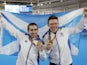 Neil Fachie and pilot Matt Rotherham of Scotland pose with medals in 2018