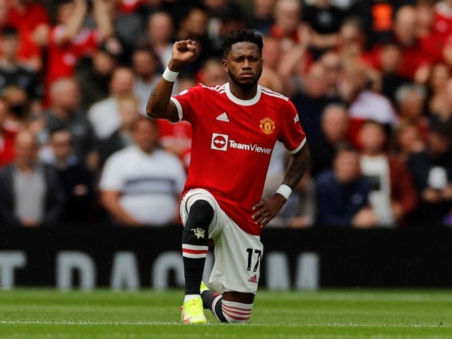 Manchester United's Fred takes a knee before the match against Leeds United on August 14, 2021 