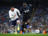 England's Wayne Rooney in action with World XI's Usain Bolt at Soccer Aid on September 4, 2021