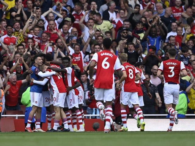 Arsenal's Pierre-Emerick Aubameyang celebrates scoring their first goal with teammates on September 11, 2021