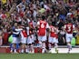Arsenal's Pierre-Emerick Aubameyang celebrates scoring their first goal with teammates on September 11, 2021