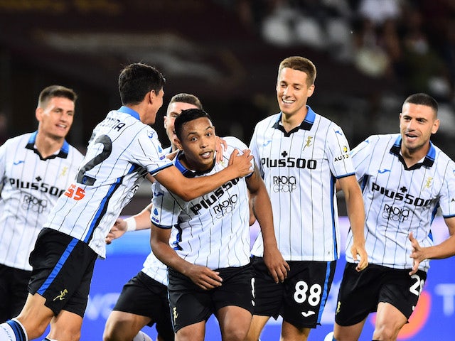 Atalanta's Luis Muriel celebrates scoring their first goal with teammates on August 21, 2021