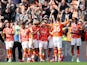 Blackpool's Josh Bowler celebrates with teammates after scoring their first goal on September 11, 2021