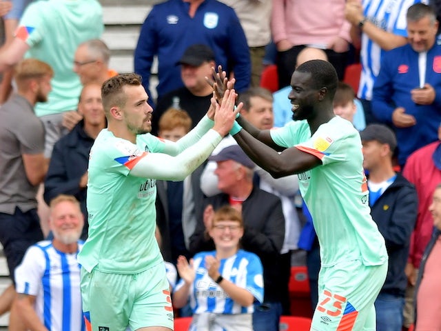 Huddersfield Town's Harry Toffolo celebrates scoring their first goal with Naby Sarr on September 11, 2021
