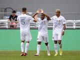Los Angeles Galaxy midfielder Samuel Grandsir (11) celebrates his goal with defender Daniel Steres (5) and defender Julian Araujo (2) in the second half against the Colorado Rapids at Dick's Sporting Goods Park on September 11, 2021