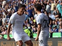 Manchester City's Bernardo Silva celebrates scoring their first goal with Rodri on September 11, 2021