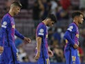 Barcelona's Gerard Pique, Yusuf Demir and Philippe Coutinho look dejected after the match on September 14, 2021