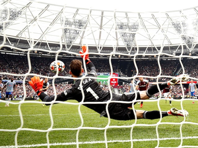 West Ham United's Mark Noble has his penalty saved by Manchester United's David de Gea on September 19, 2021