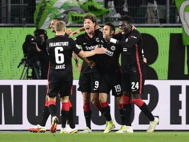 Eintracht Frankfurt's Sam Lammers celebrates scoring their first goal with teammates on September 19, 2021