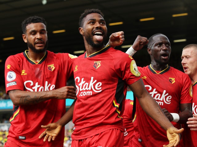 Watford's Emmanuel Dennis celebrates scoring their first goal against Norwich City in the Premier League on September 18, 2021