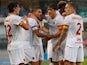 Roma's Lorenzo Pellegrini celebrates scoring their first goal with teammates on September 19, 2021