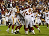 Washington Football Team place kicker Dustin Hopkins is mobbed by teammates after kicking the game winning field goal against the New York Giants on September 17, 2021