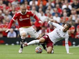 Aston Villa's Matty Cash in action with Manchester United's Luke Shaw in the Premier League on September 26, 2021
