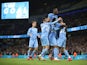 Manchester City's players celebrate after scoring against Wycombe Wanderers on September 21, 2021