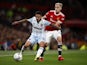 West Ham United's Manuel Lanzini in action with Manchester United's Donny van de Beek in the EFL Cup on September 22, 2021