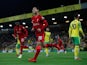 Liverpool's Takumi Minamino celebrates scoring their first goal against Norwich City in the EFL Cup on September 21, 2021