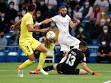 Real Madrid's Karim Benzema in action with Villarreal's Geronimo Rulli on September 25, 2021