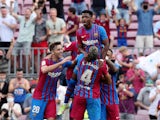 Barcelona's Ansu Fati celebrates scoring their third goal with Ronald Araujo and teammates on September 27, 2021