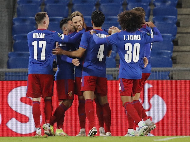 Basel's Michael Lang celebrates scoring their third goal with teammates on September 30, 2021