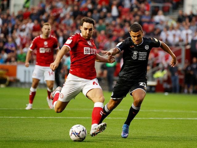 Bristol City's Matty James in action with Swansea City's Joel Latibeaudiere in August 2021