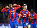 Crystal Palace's Wilfried Zaha celebrates scoring their first goal against Brighton & Hove Albion in the Premier League on September 27, 2021