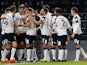 Derby County's Craig Forsyth celebrates scoring their first goal with teammates on September 29, 2021