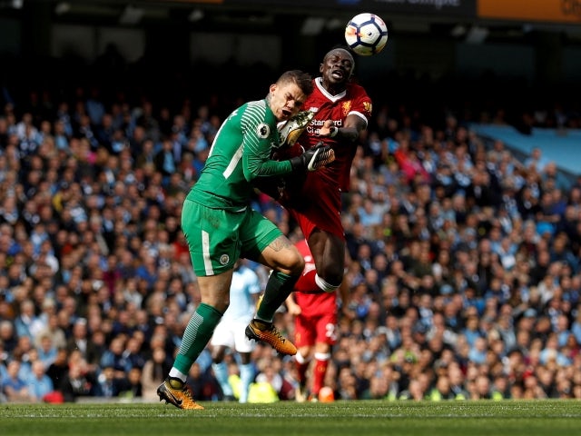 Manchester City's Ederson is fouled by Liverpool's Sadio Mane resulting in a red card on September 9, 2017