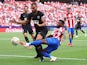 Elche's Gonzalo Verdu in action with Atletico Madrid's Thomas Lemar on August 22, 2021