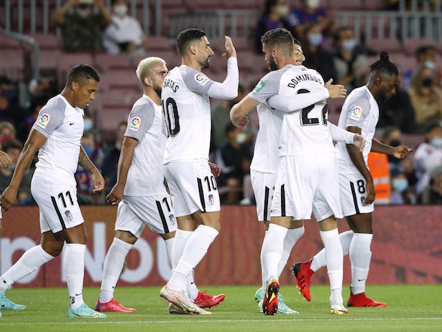 Granada's Domingos Duarte celebrates scoring their first goal with teammates on September 20, 2021