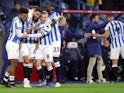 Huddersfield Town's Alex Vallejo celebrates scoring their first goal with teammates on September 28, 2021